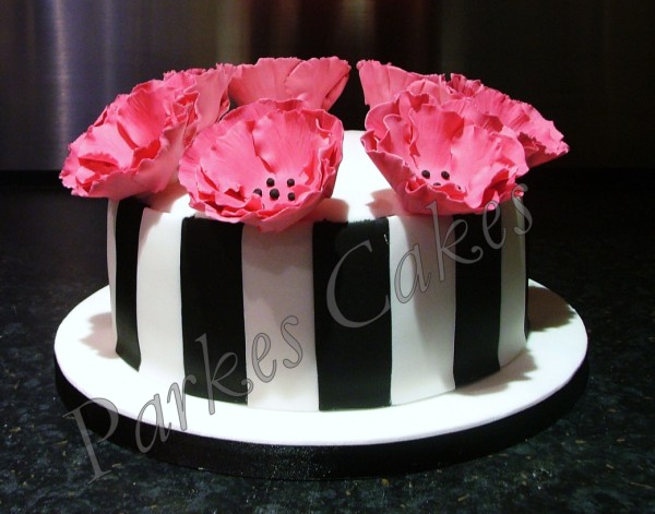 black and white poppy birthday cake